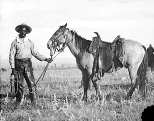 Vaquero negro y caballo, c. 1890-1920